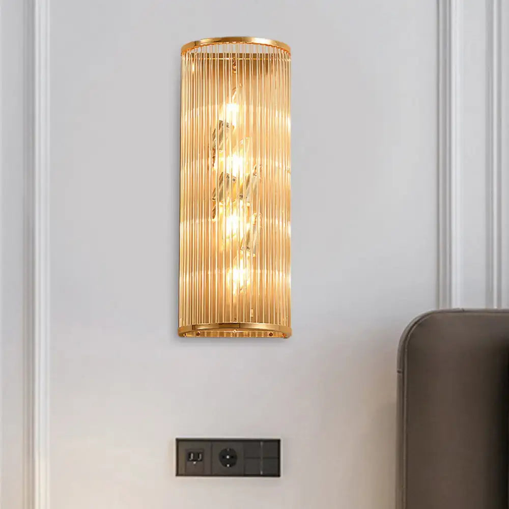 Modern gold cylinder wall mount lamp with vertical crystal rods featuring an elegant design for hallway lighting