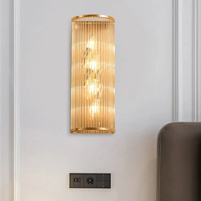 Modern gold cylinder wall mount lamp with vertical crystal rods featuring an elegant design for hallway lighting