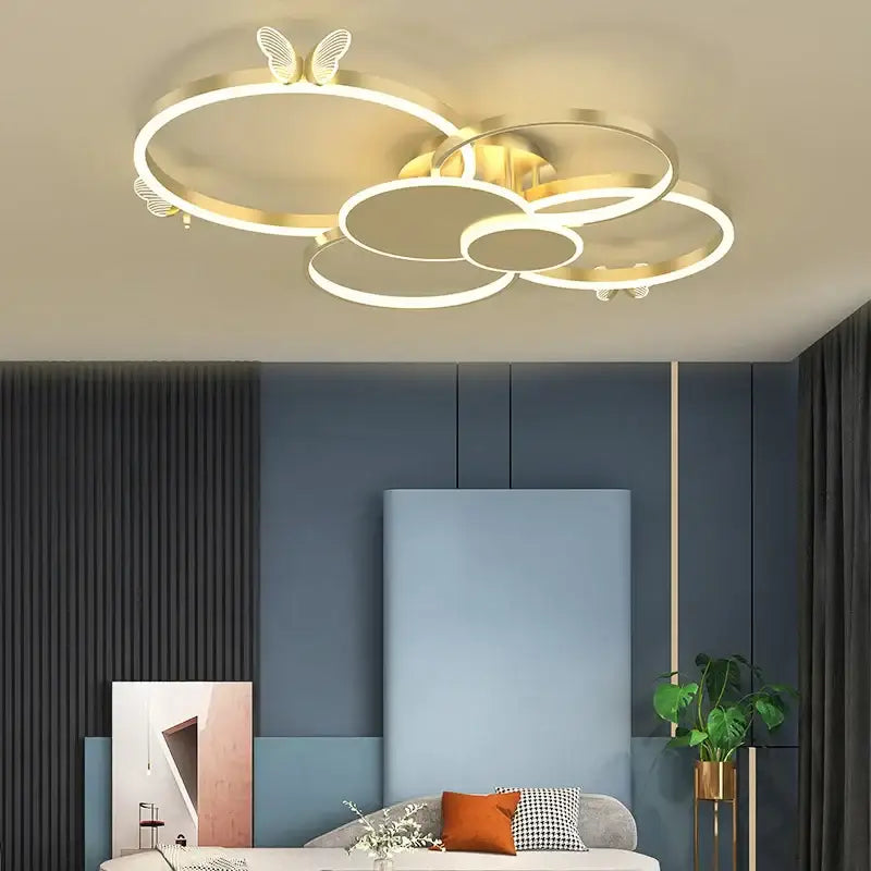 Modern gold decorbites butterfly light round led ceiling fixture with interconnected rings and butterfly wing accents
