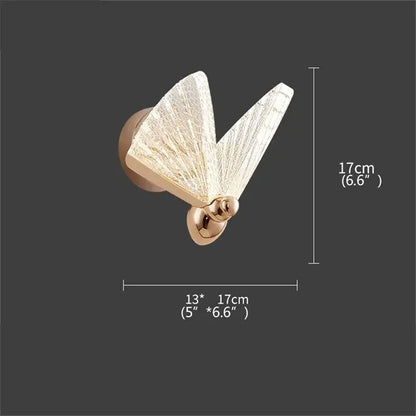 Gold-toned decorbites butterfly wall light with translucent crackled glass wings and polished metallic body for bedroom decor