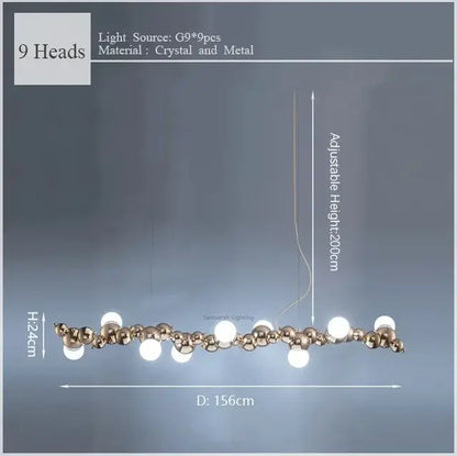 Modern gold decorbites caterpillar metal pendant light with nine adjustable crystal and metal globes for dining room