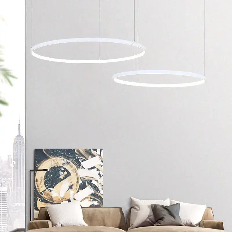 Two minimalist white circular led pendant lights from the modern gold decorbites circular led chandelier for dining room use