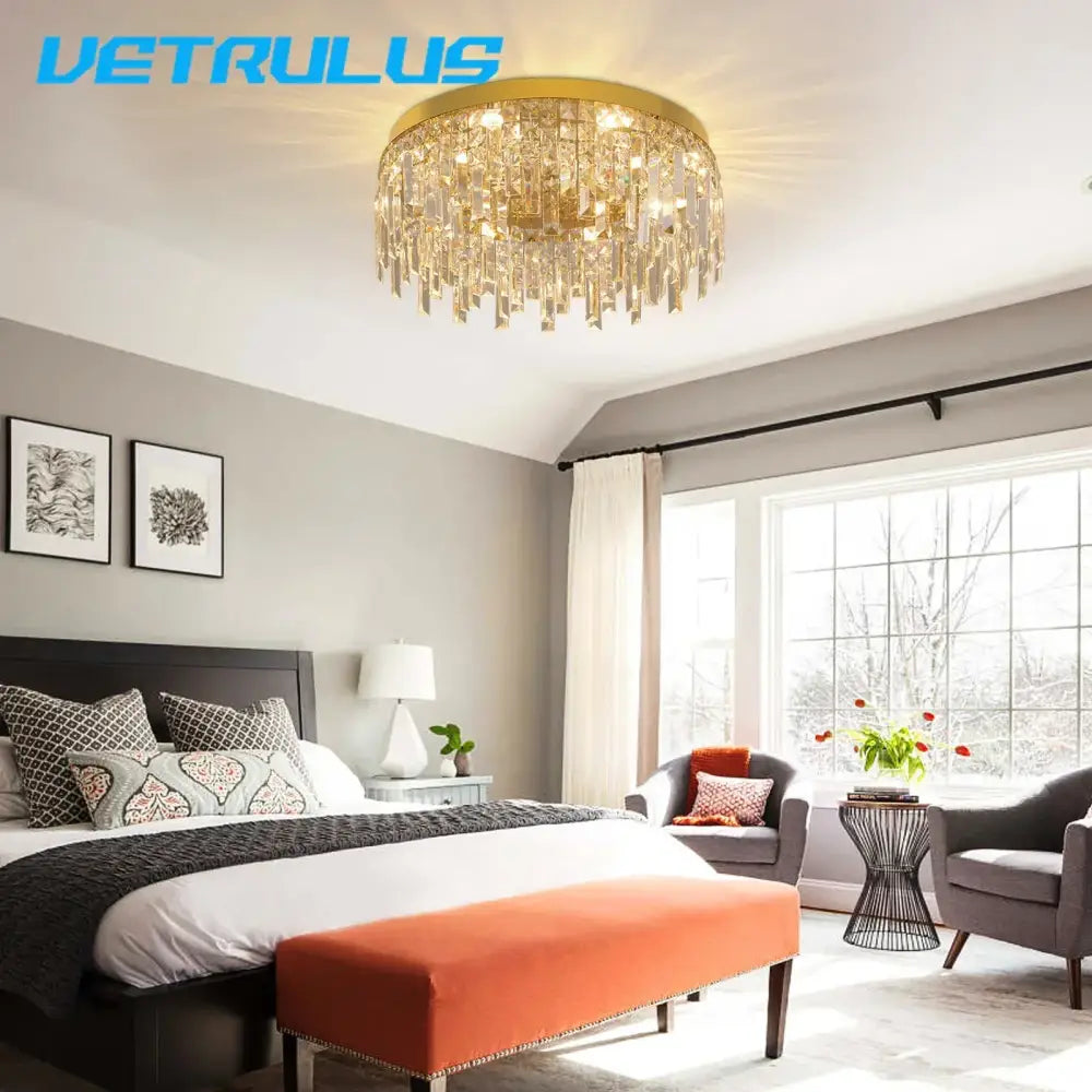 Modern gold decorbites crystal ceiling chandelier with circular frame and dangling prisms for dining room lighting