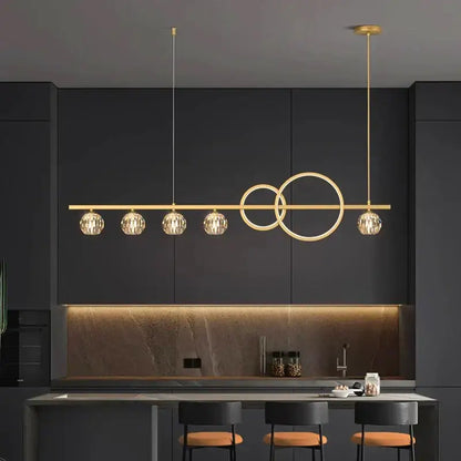 Modern gold decorbites crystal chandelier pendant light with four faceted crystal globes and interlocking circle design
