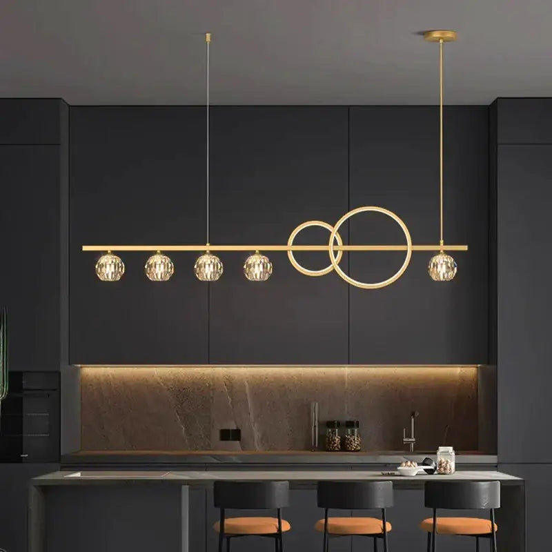 Modern gold decorbites crystal chandelier pendant light with four faceted crystal globes and interlocking circle design