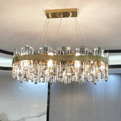 Brilliant gold-toned decorbites crystal chandelier with cascading clear prisms for modern living room decor