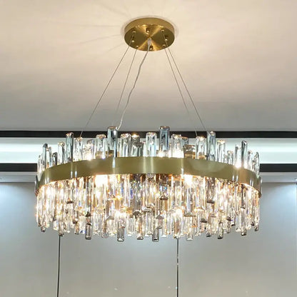 Modern gold decorbites crystal chandelier with circular metal frame and cascading clear prisms for living room use