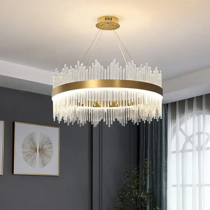 Modern gold decorbites crystal chandelier featuring clear glass rods in a cascading design for living room use