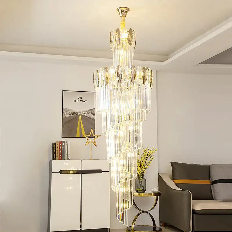 Modern gold decorbites crystal chandelier with cascading clear crystal prisms for staircase and living room lighting