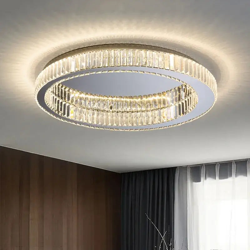 Modern gold decorbites crystal circle ceiling chandelier featuring clear faceted crystal circle elements in a living room setting