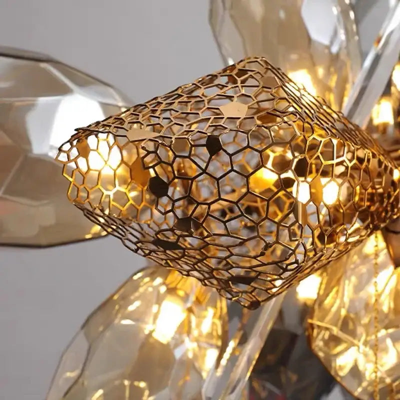 Modern gold decorbites crystal duplex chandelier component featuring golden honeycomb metal and faceted crystal accents
