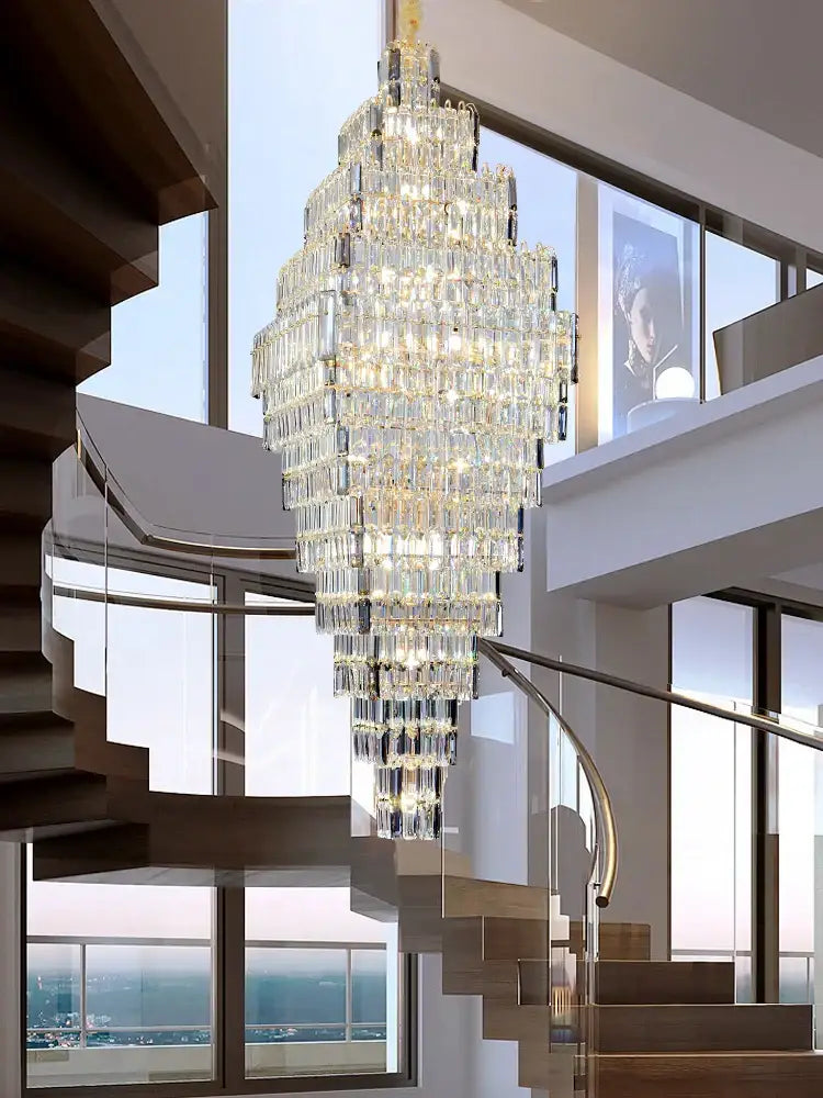 Modern gold decorbites crystal large multi-tiered chandelier with rectangular prisms above a staircase pendant light