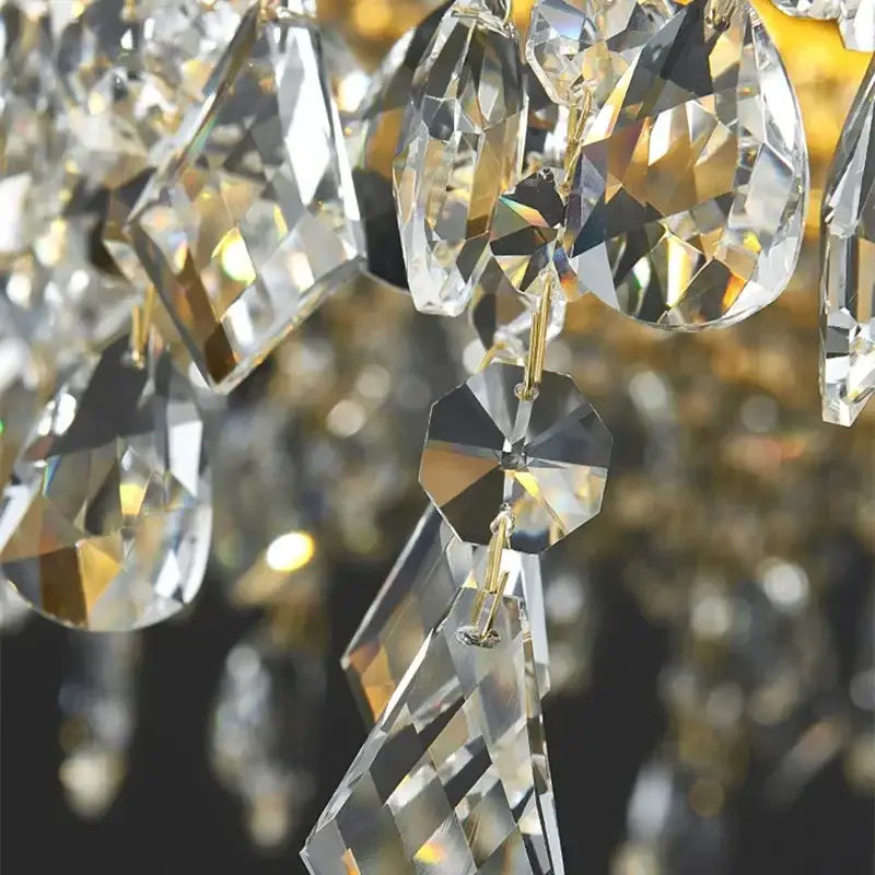 Faceted decorbites crystal led ceiling chandelier with clear geometric crystals and gold-toned metal for dining room