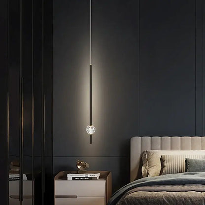 A sleek black pendant light with a crystal globe base in modern gold decorbites crystal led chandelier style