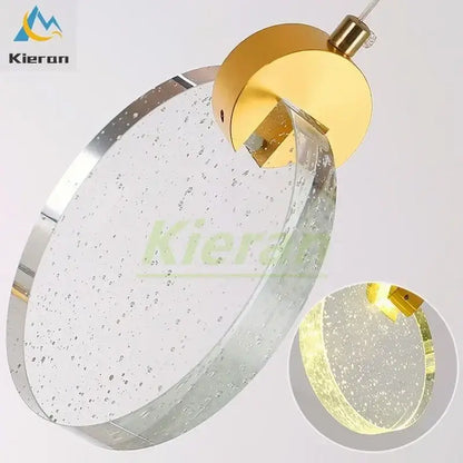 Modern gold decorbites crystal led circular pendant light with bubble-filled glass disc and chrome trim for bedroom use