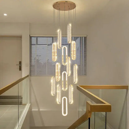 A modern gold decorbites crystal led chandelier with cascading oval crystal pendants for living room staircase