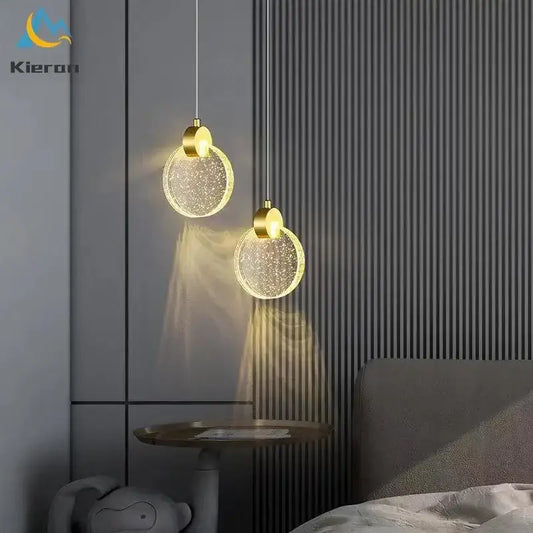 Two golden circular decorbites crystal led pendant lights with sparkling glass shades for modern living room decor