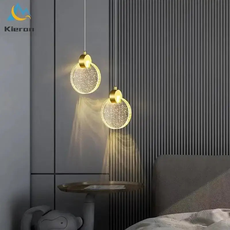 Two golden circular decorbites crystal led pendant lights with sparkling glass shades for modern living room decor