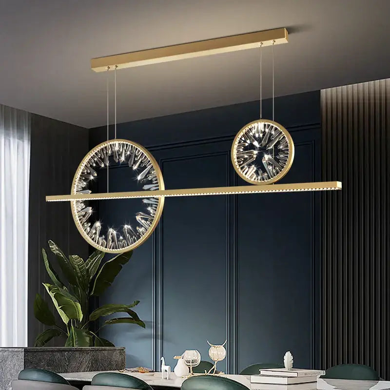 Modern gold decorbites crystal pendant chandelier with circular crystal accents and sleek horizontal bar design for dining room lighting