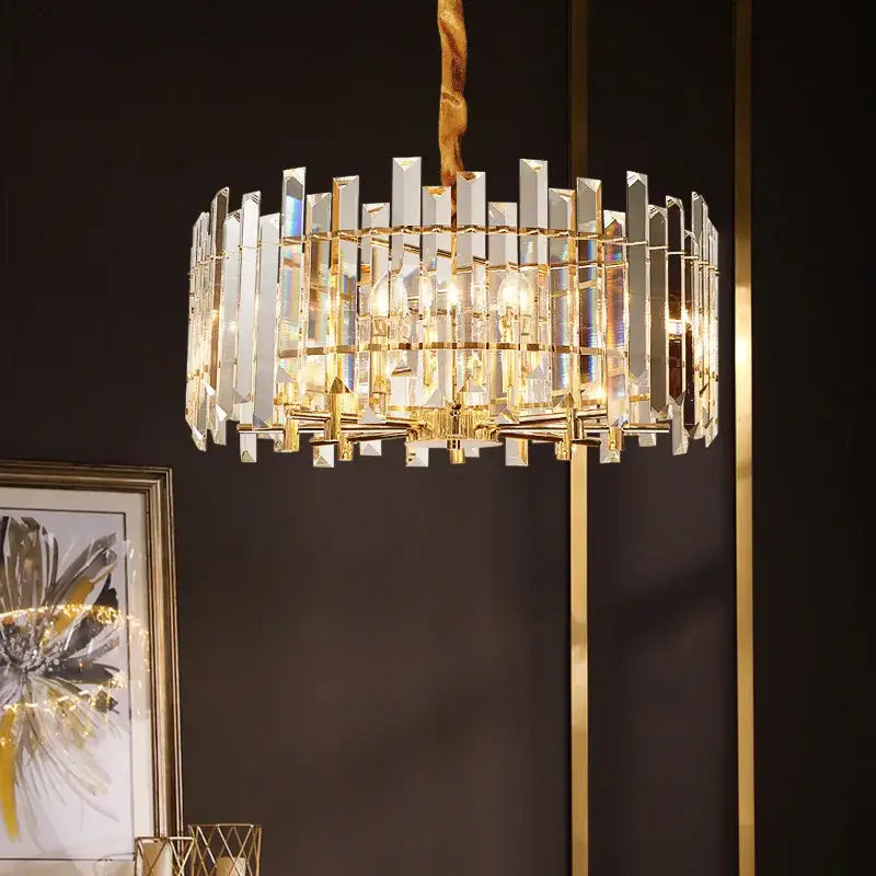 A modern gold decorbites crystal round chandelier with clear crystal bars and concentric rings for living room lighting