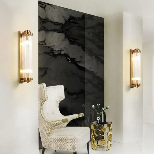 Modern gold decorbites crystal wall sconce with gold finish and vertical frosted glass panels for bedroom lighting