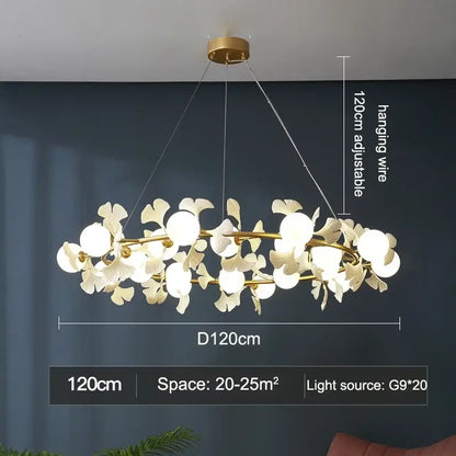 A modern decorbites gingko leaf branch chandelier with gold-toned metal frame and white ceramic flowers