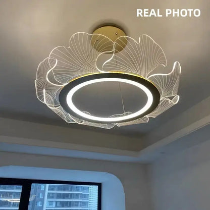 Modern gold decorbites ginkgo acrylic led pendant with circular led ring and leaf-like wireframe for dining room light