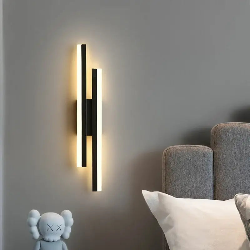 Modern black wall lamp with two vertical led bars emitting warm glow decorbites led strip bedroom sconce light