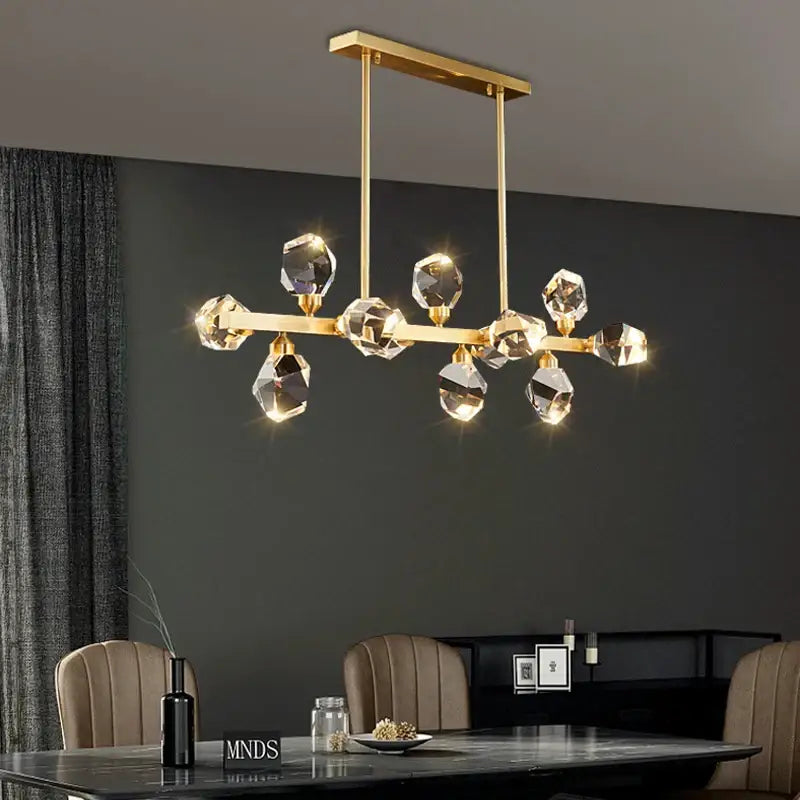Modern gold diamond crystal brass led pendant light featuring faceted crystal droplets on a rectangular frame