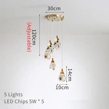 A modern gold diamond crystal led ceiling chandelier with five clear glass pendants for dining room lighting