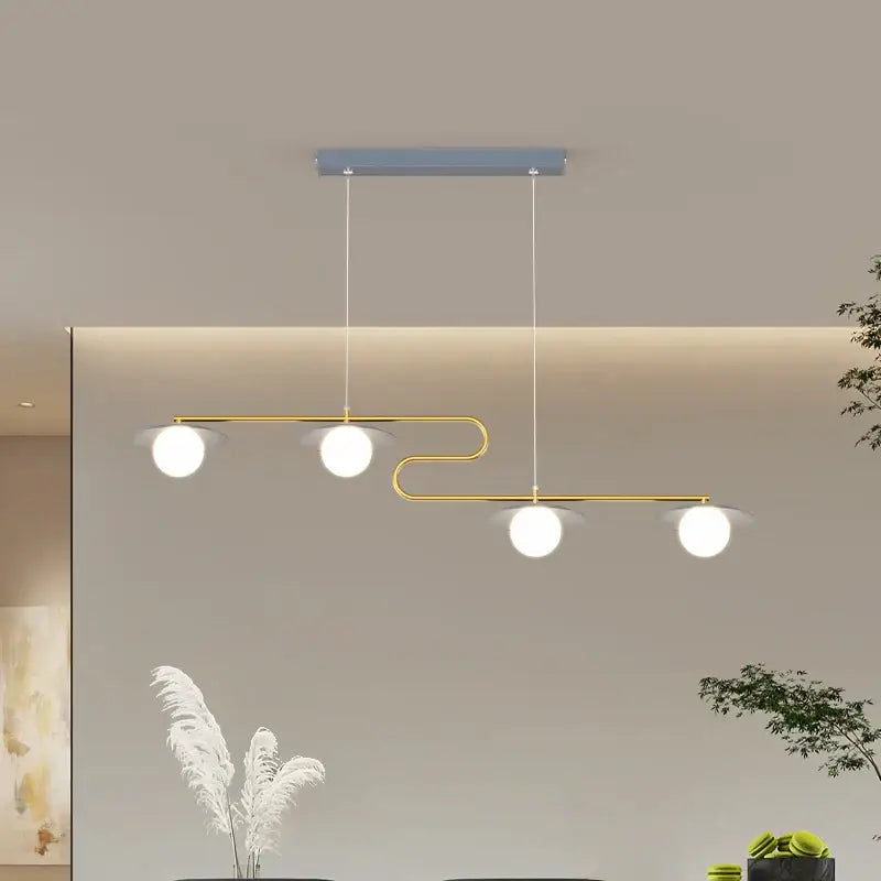 Modern gold dimmable led ceiling chandelier with three white glass bulbs and curved metal frame for dining room decorbites dimmable led