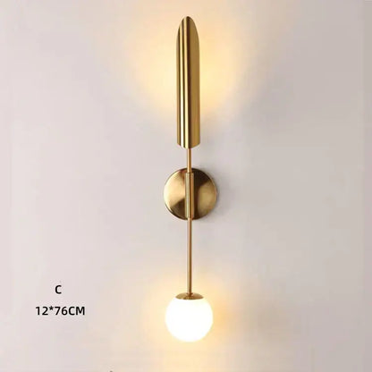 Modern gold double-head wall lights with sleek elongated stem and frosted glass globe for living room decorbites wall lights