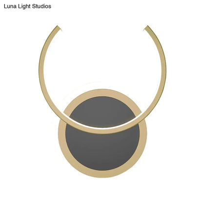 Modern gold dual ring led wall sconce featuring a minimalist gold-toned pendant light with a circular base and arched ring