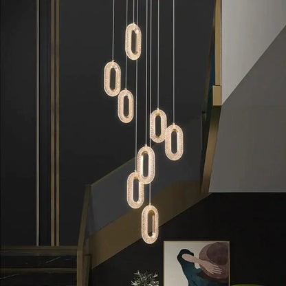 Modern gold duplex crystal chandelier featuring oval-shaped pendant lights with sparkling crystal finish for villa living room