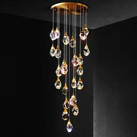 A modern gold elegant crystal chandelier with faceted clear crystals and circular ceiling mount for living room decorbites elegant