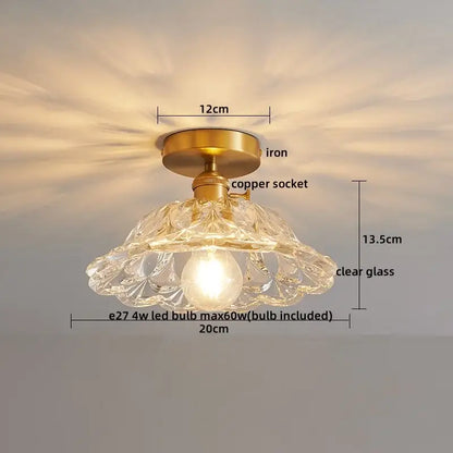 A delicate clear glass led ceiling lamp with brass iron base and copper socket for modern living room lighting