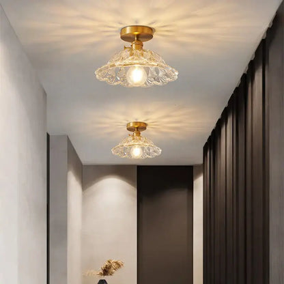 Two elegant crystal glass flush mount led ceiling lamps with gold-toned metal fixtures for living room lighting