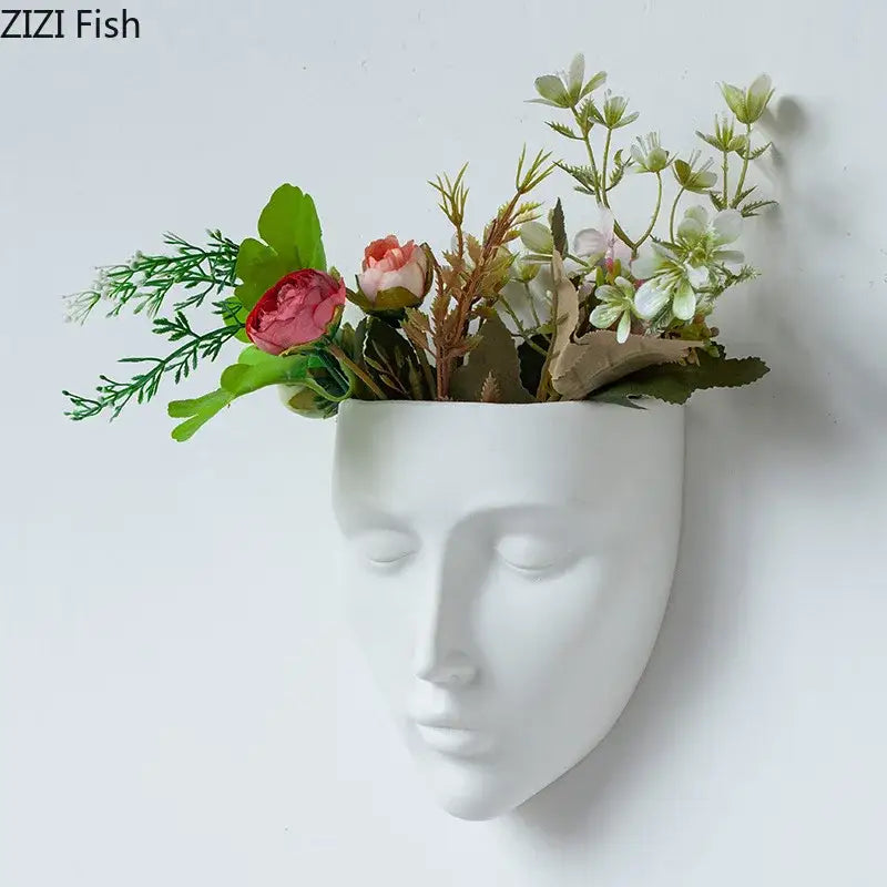 Modern gold decorbites ceramic wall-mounted face vase in white holding artificial flowers and greenery for living room decor