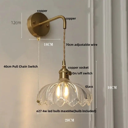 Copper-finished wall light with clear glass petal-shaped shade and adjustable wire for modern bedroom decorbites clear glass