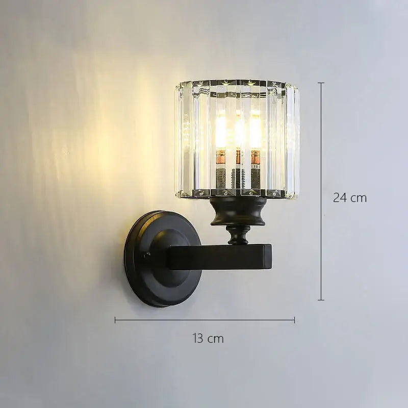 Black metal wall lamp with cylindrical crystal glass shade and modern gold faceted glass shade wall lamp design