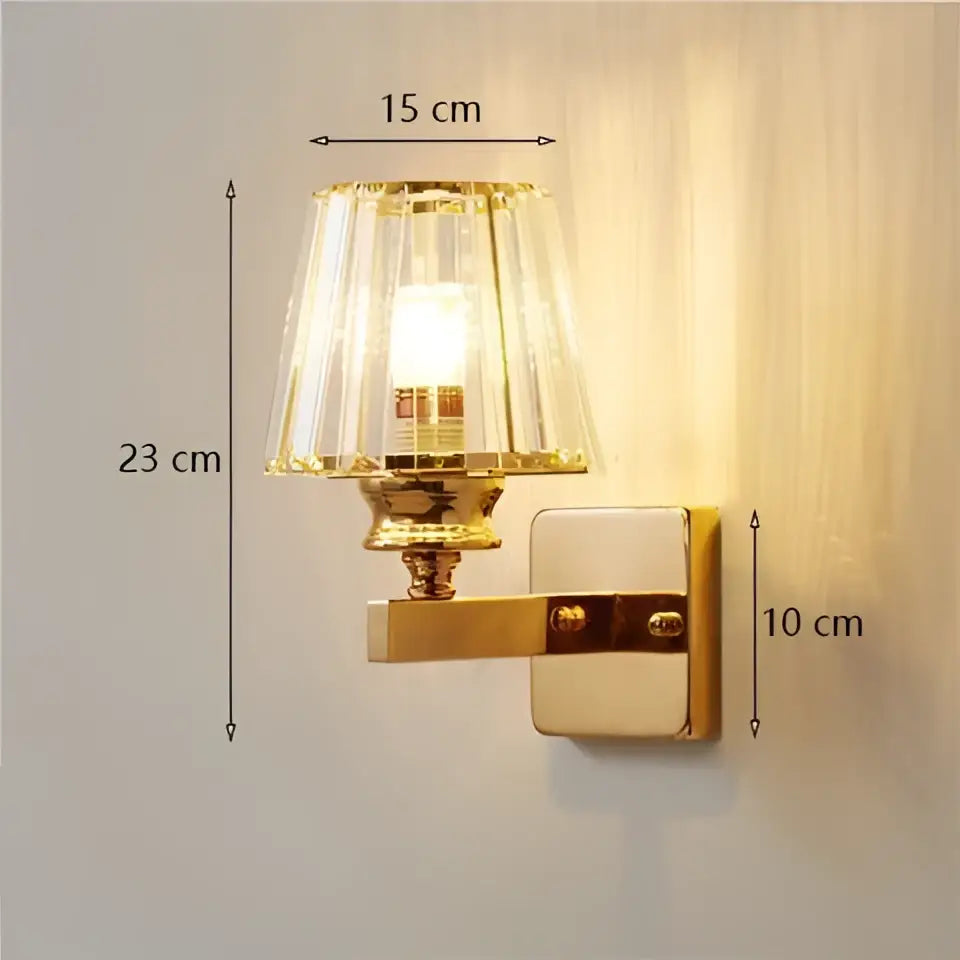 Modern gold-toned wall lamp with a faceted crystal glass shade glass shade wall sconce for living room use
