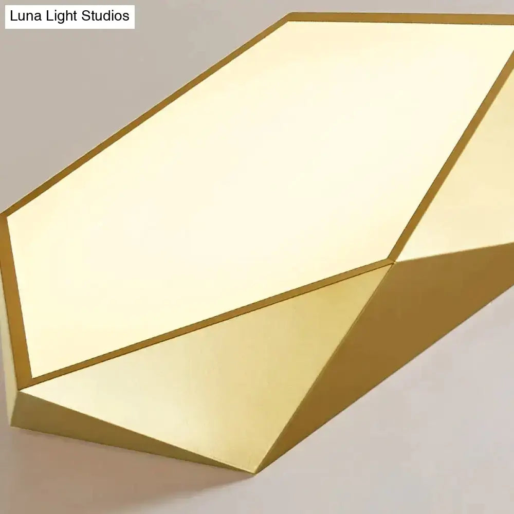 Decorbites modern gold-finished geometric wall sconce with faceted design and soft diffused indoor lighting