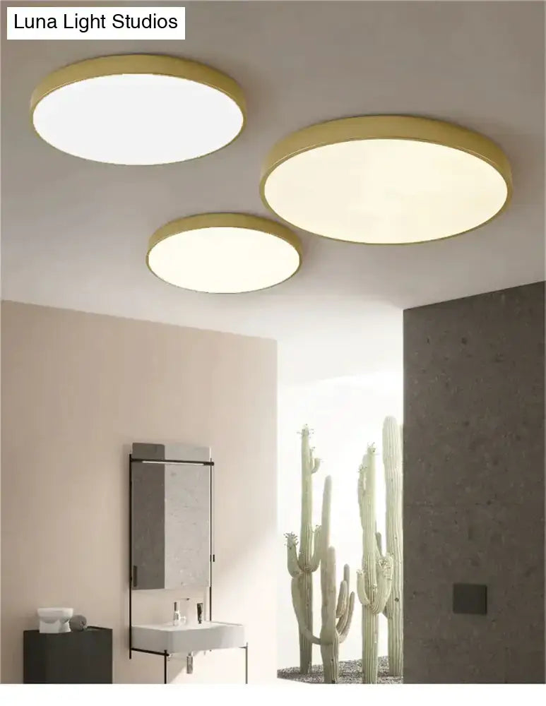 Three decorbites modern ceiling light fixtures with gold frames and warm diffused glow for indoor use