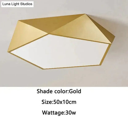 Gold geometric ceiling light with modern faceted design and white illuminated center for indoor living spaces