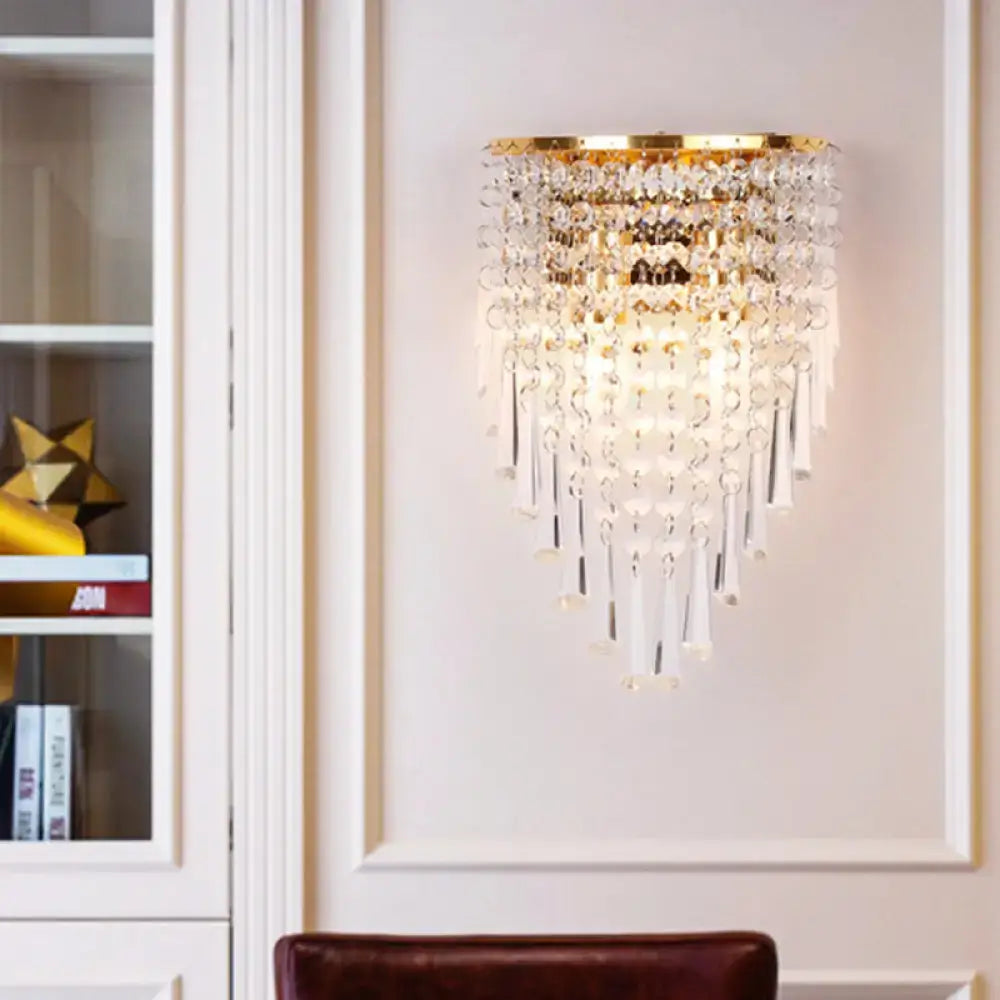 Elegant modern gold finish wall light with clear crystal droplets and beads designed for bedroom use