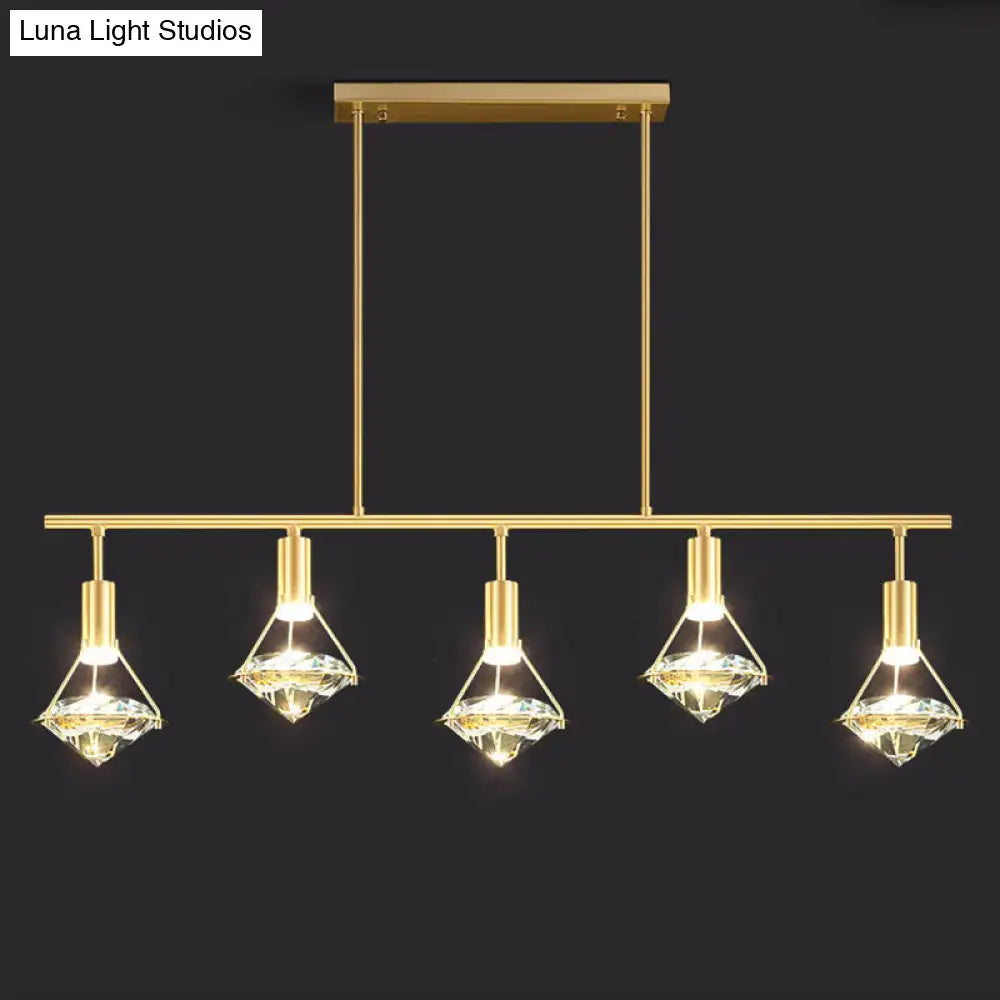 Modern gold finish light fixture with five diamond-shaped crystal shades for kitchen island lighting