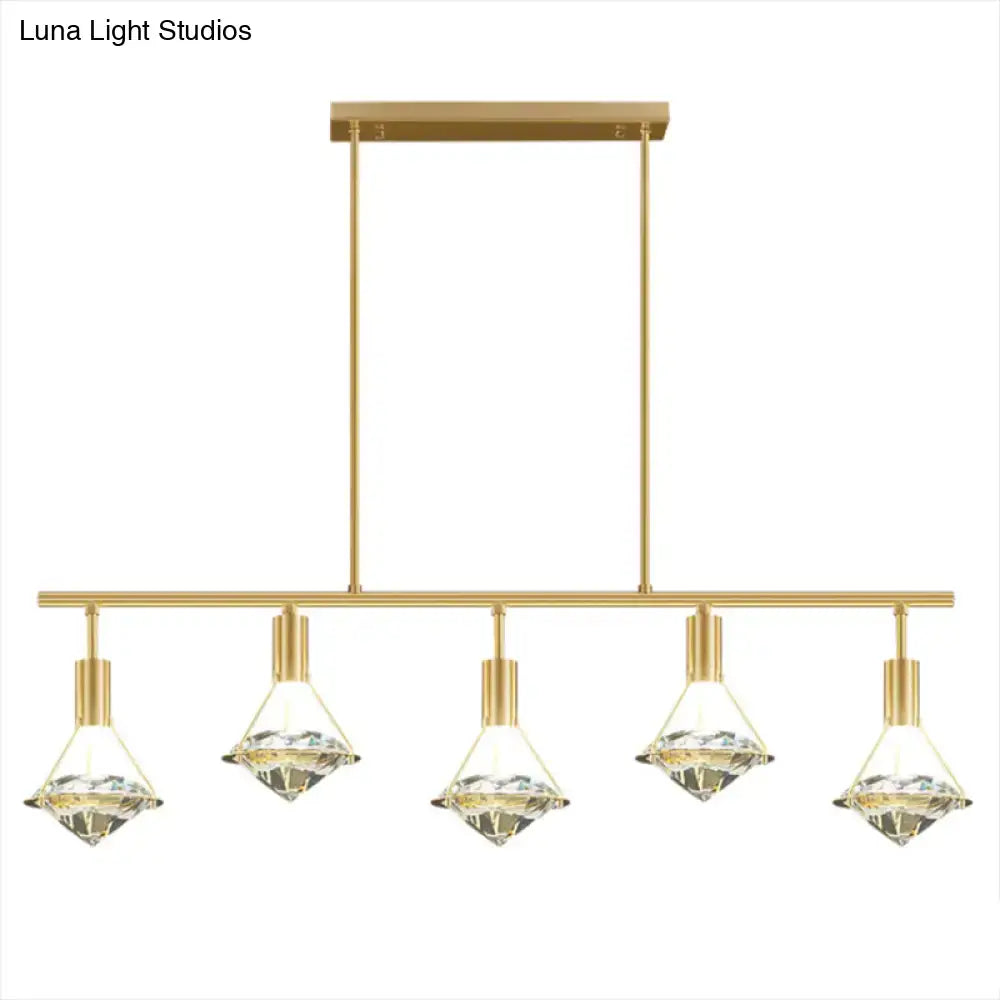Modern gold finish light fixture with five crystal diamond-shaped shades for kitchen island lighting