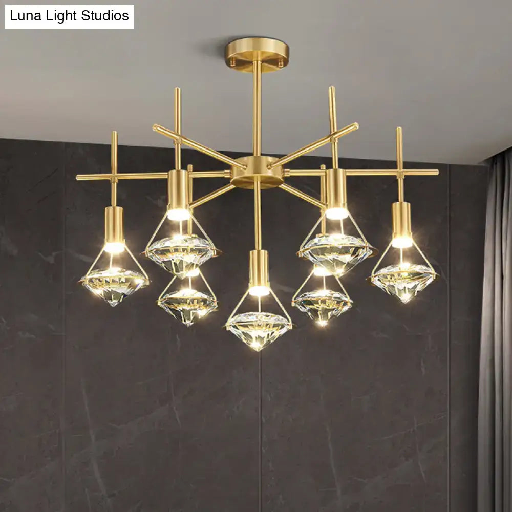 Modern gold finish light fixture with five crystal diamond-shaped shades on geometric frame for kitchen island