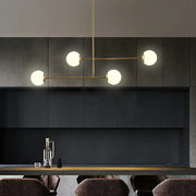 Decorbites minimalist gold finish pendant light with opal glass shade and four spherical bulb base brass bulbs