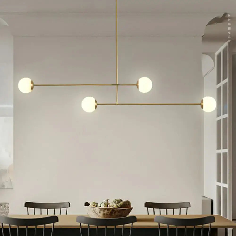 Decorbites minimalist gold finish pendant light with four opal glass bulbs and brass bulb base in geometric design